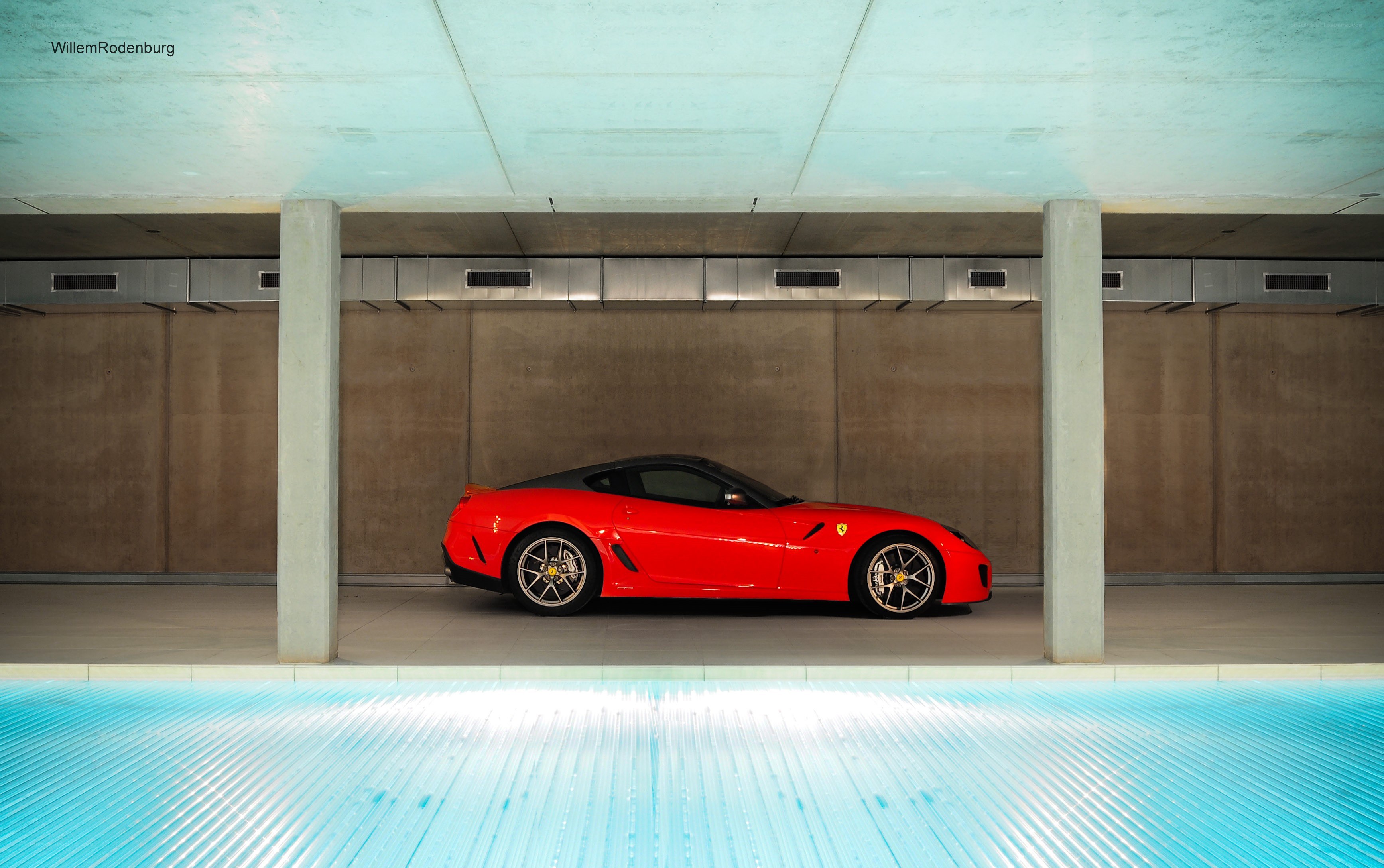 Red Ferrari in modern garage