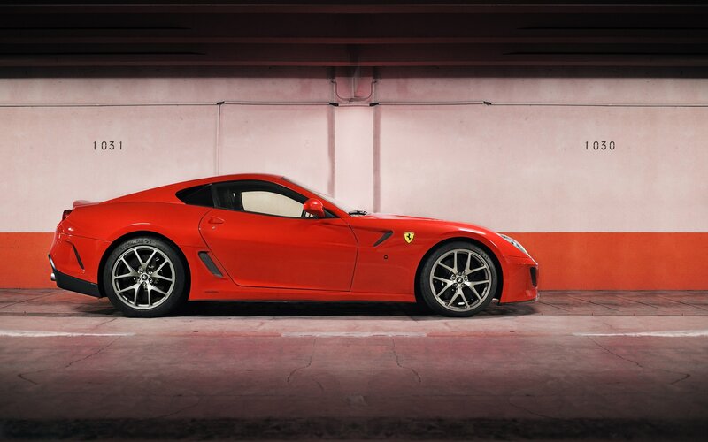 Red Ferrari in parking garage
