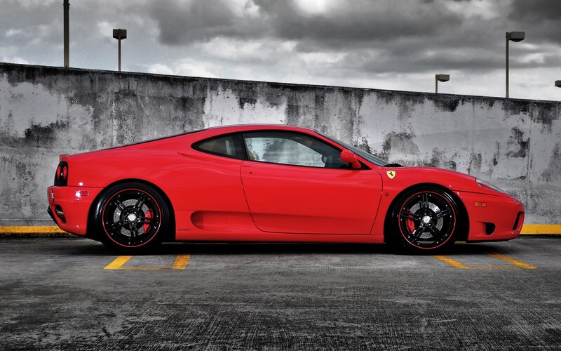 Red Ferrari in parking garage