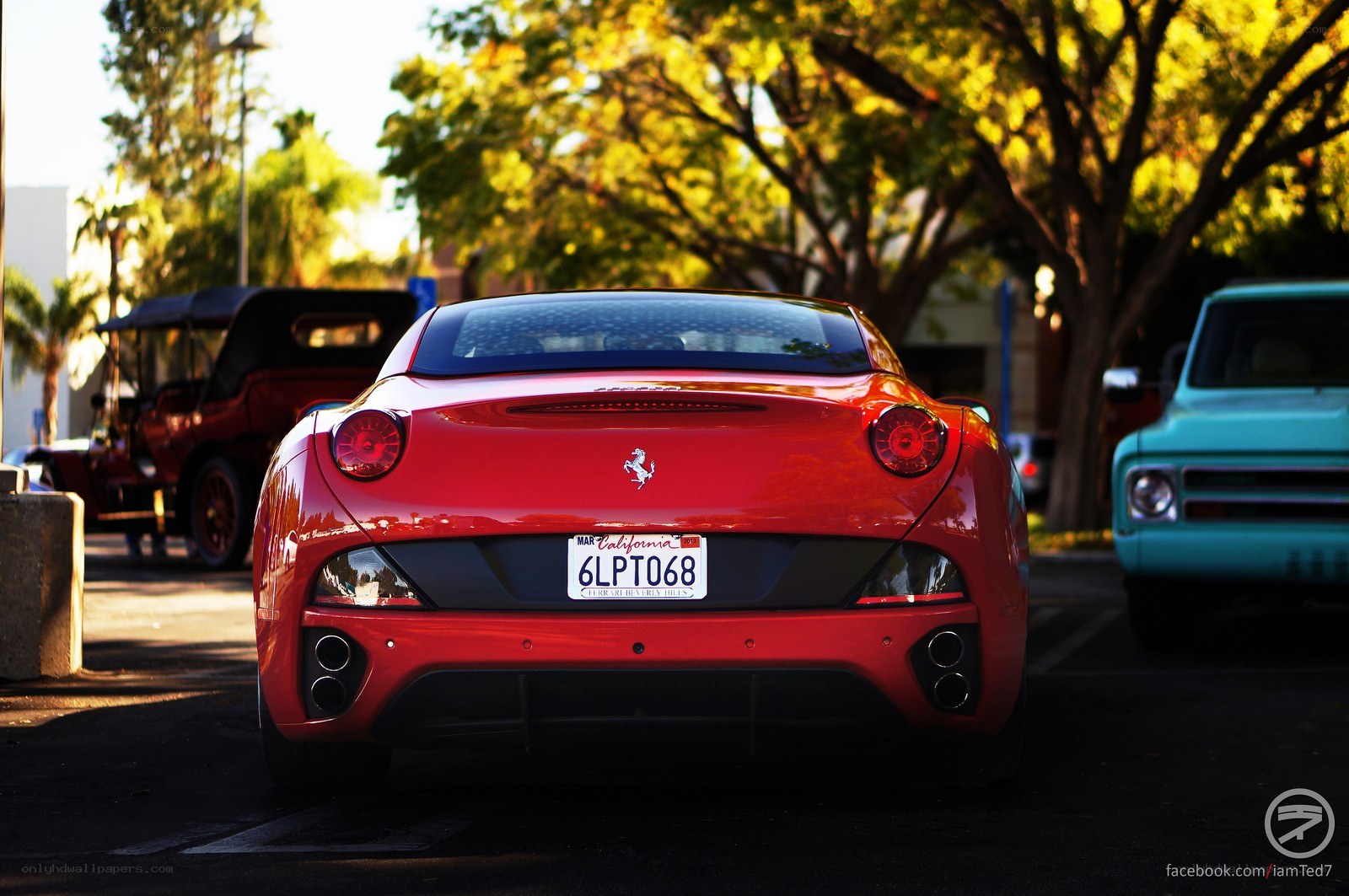 Red Ferrari in parking lot