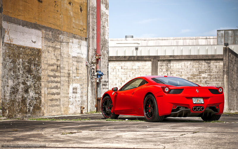 Red Ferrari in urban alley