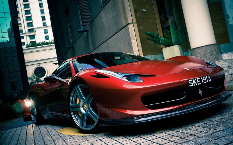 Red Ferrari in urban setting