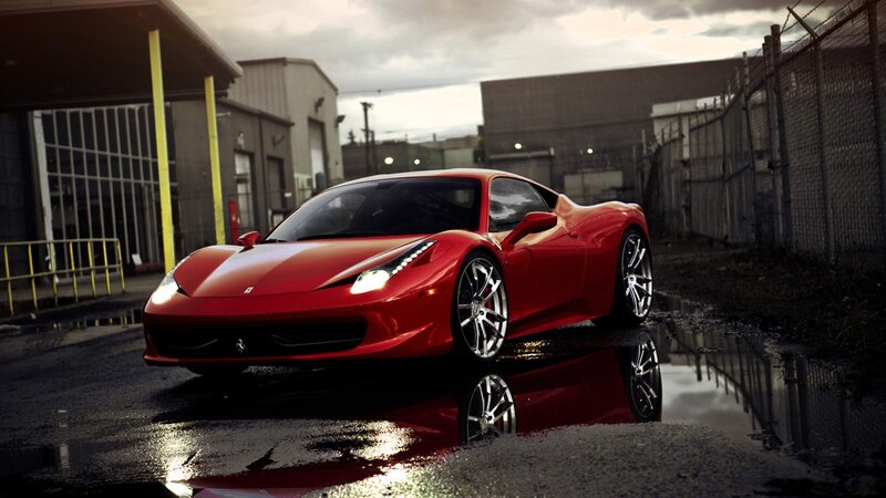 Red Ferrari in wet alley
