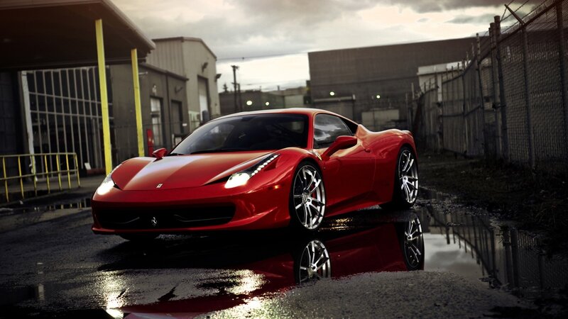 Red Ferrari in wet alley