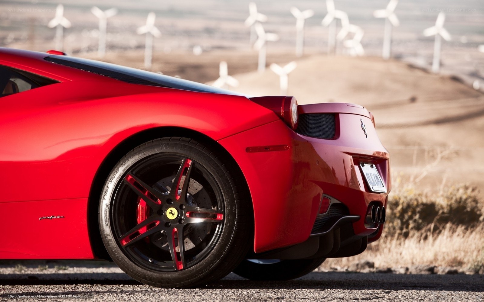 Red Ferrari in wind farm