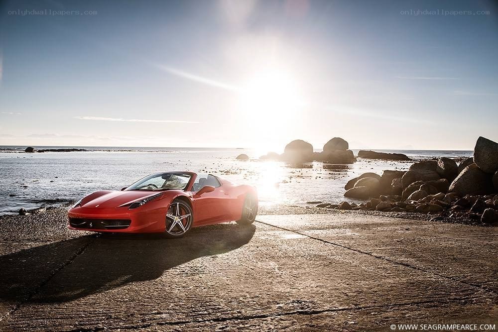 Red Ferrari on a beach