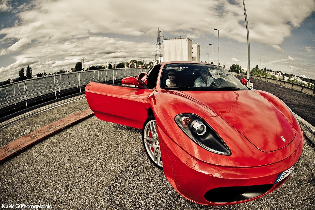 Red Ferrari on a bridge