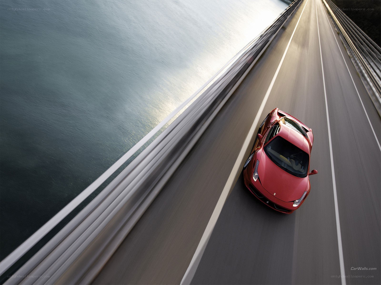 Red Ferrari on a bridge
