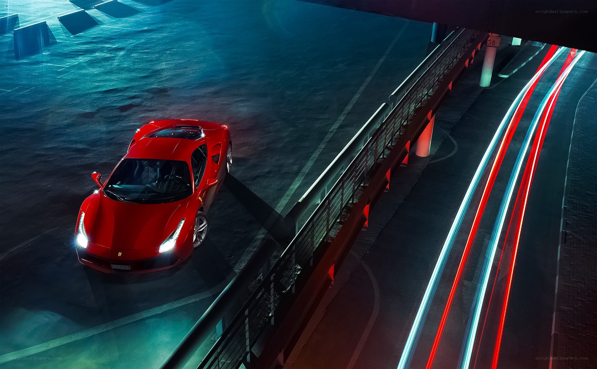 Red Ferrari on a city bridge