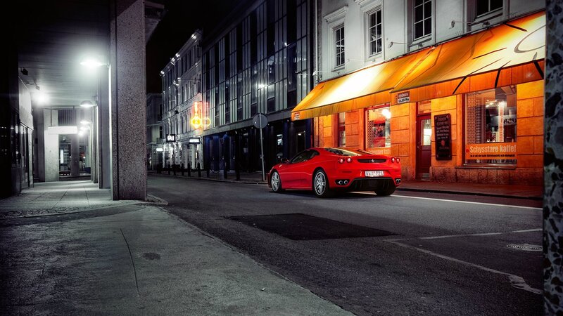Red Ferrari on a city street