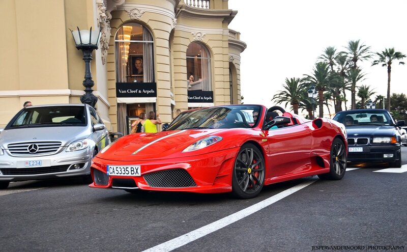 Red Ferrari on a city street