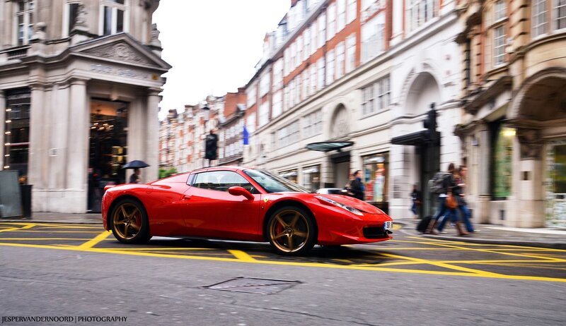 Red Ferrari on a city street