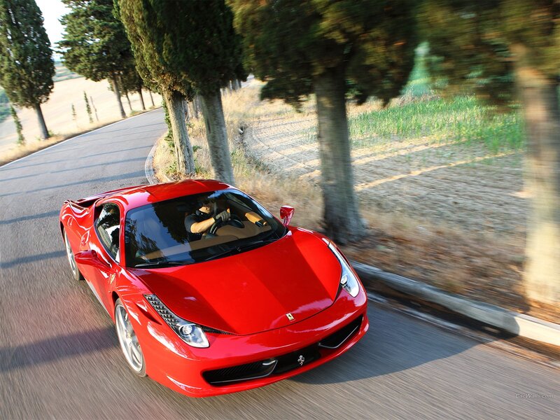 Red Ferrari on a country road