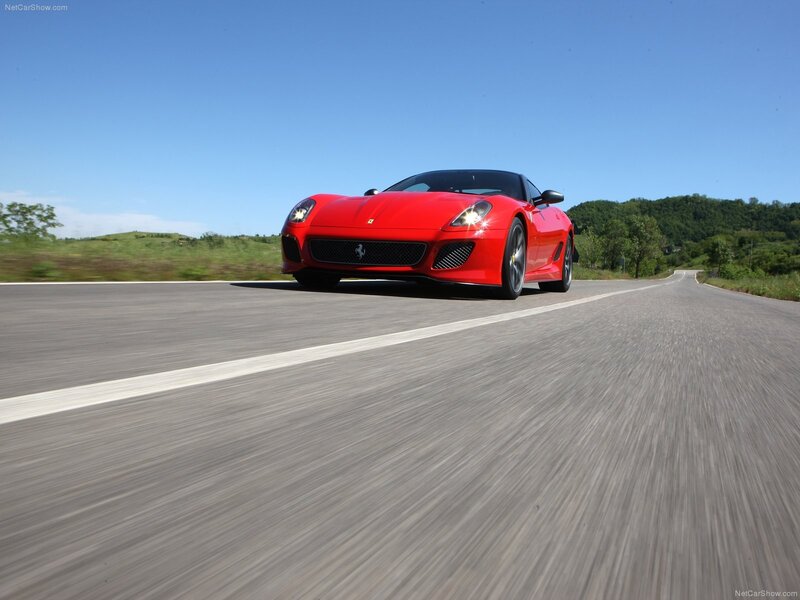 Red Ferrari on a country road