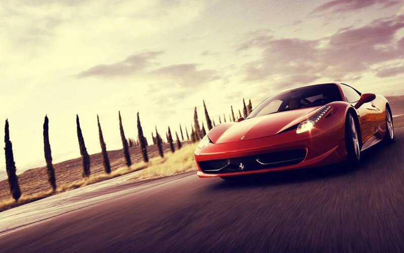 Red Ferrari on a country road
