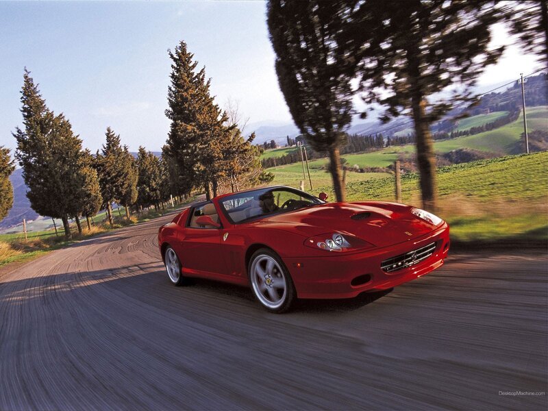 Red Ferrari on a country road