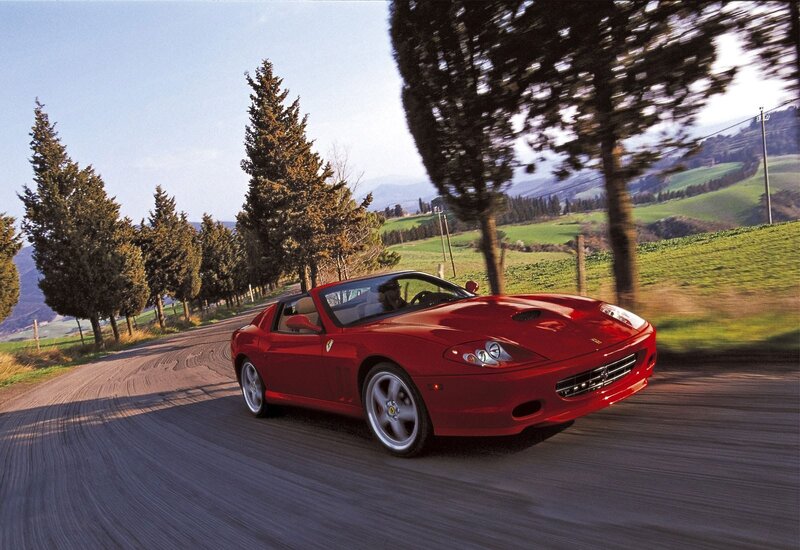 Red Ferrari on a country road