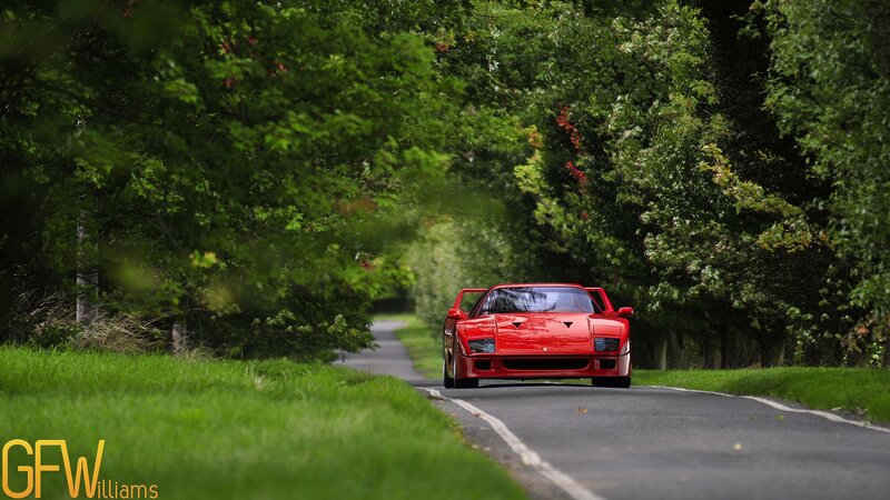 Red Ferrari on a country road