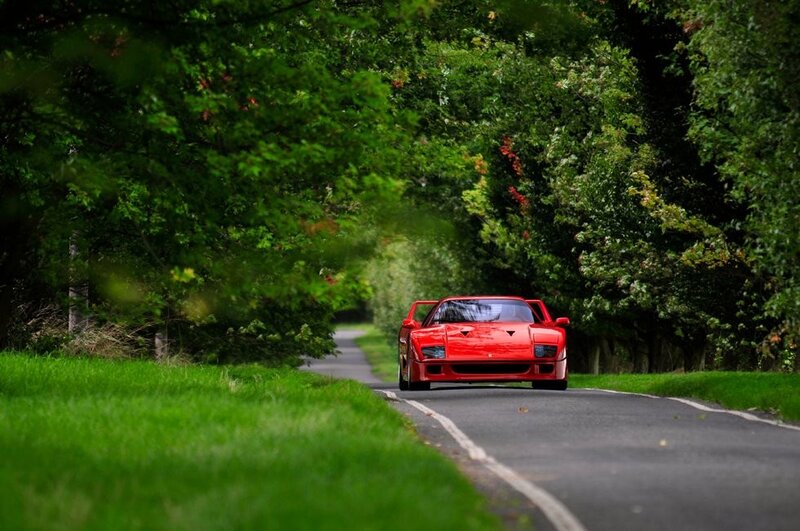 Red Ferrari on a country road