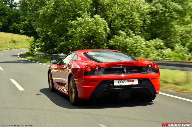Red Ferrari on a country road