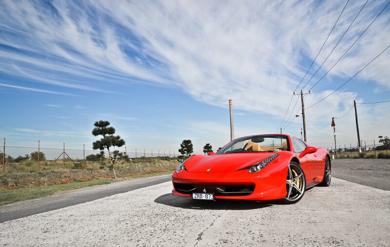 Red Ferrari on a country road