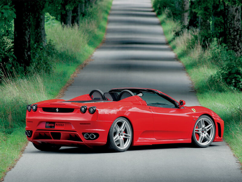 Red Ferrari on a country road