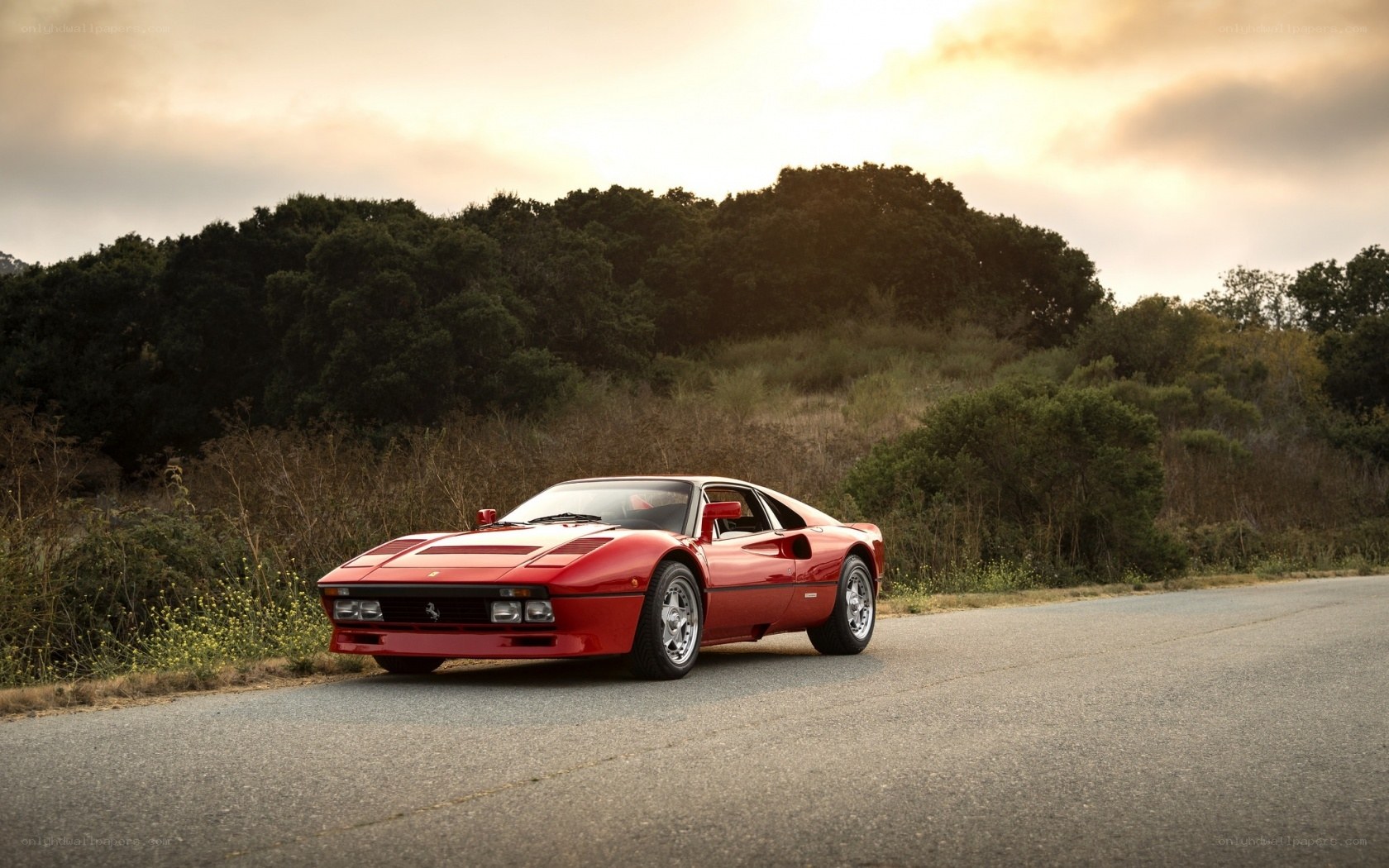 Red Ferrari on a country road