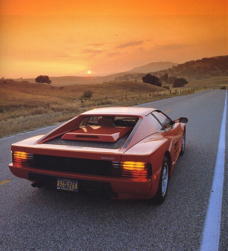 Red Ferrari on a country road