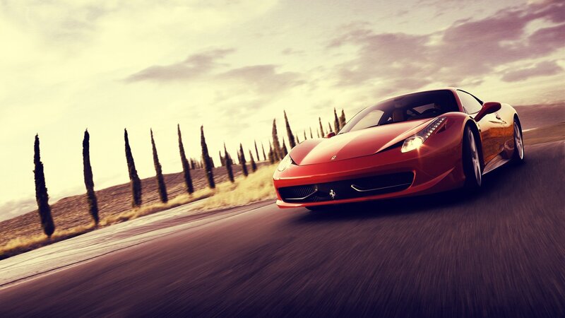 Red Ferrari on a country road