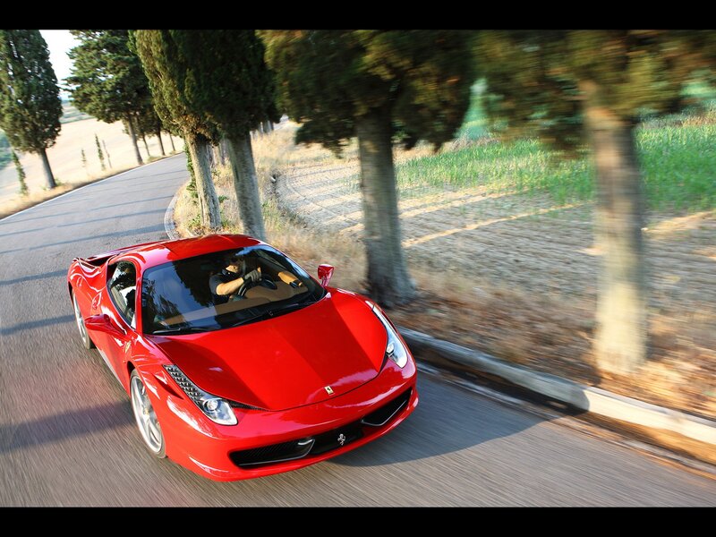 Red Ferrari on a country road