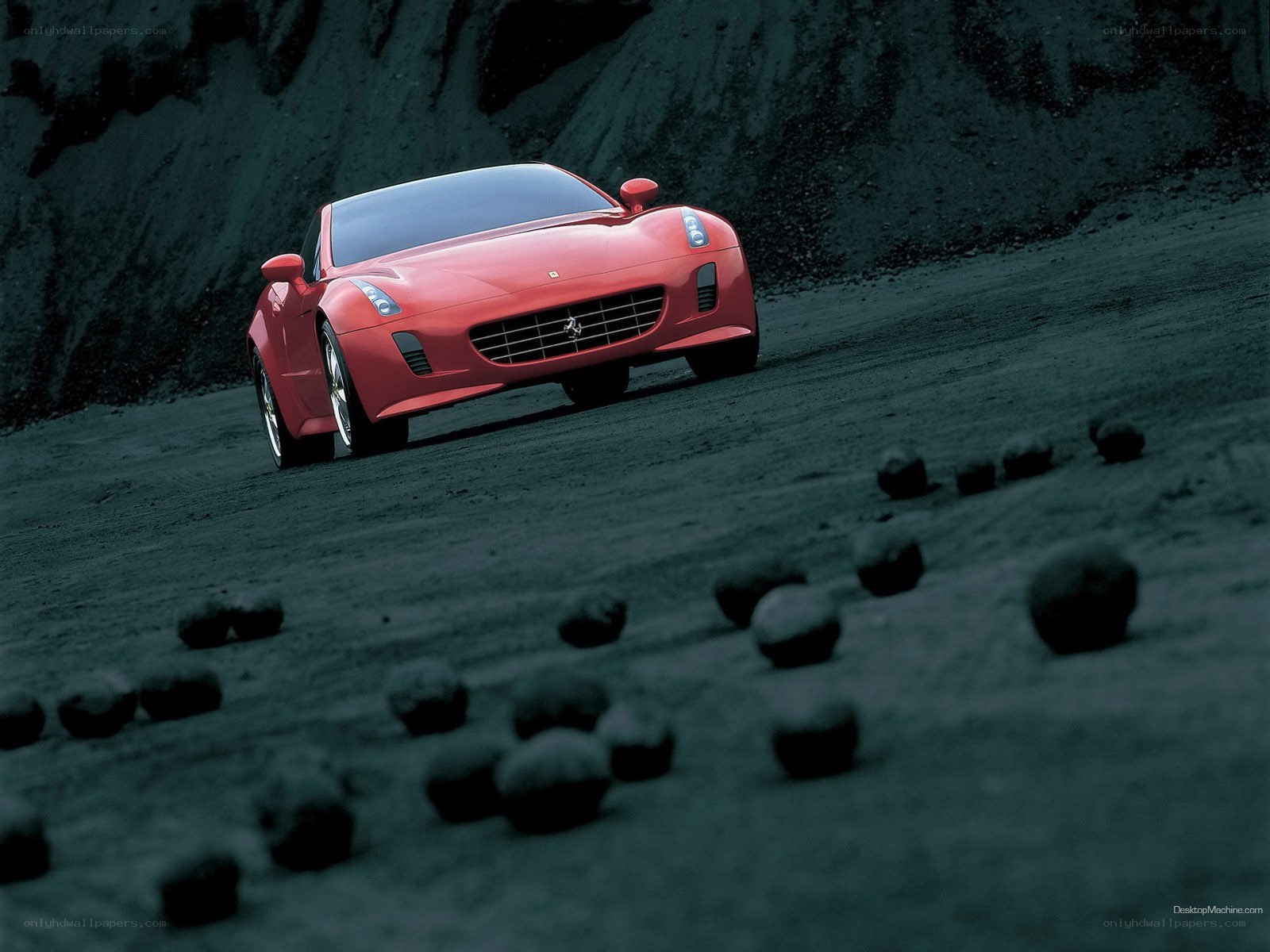 Red Ferrari on a dark road