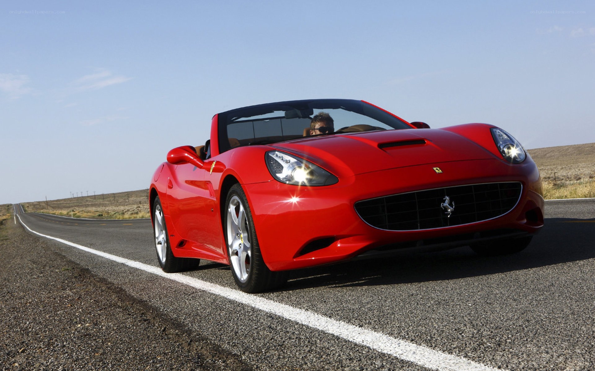 Red Ferrari on a desert road