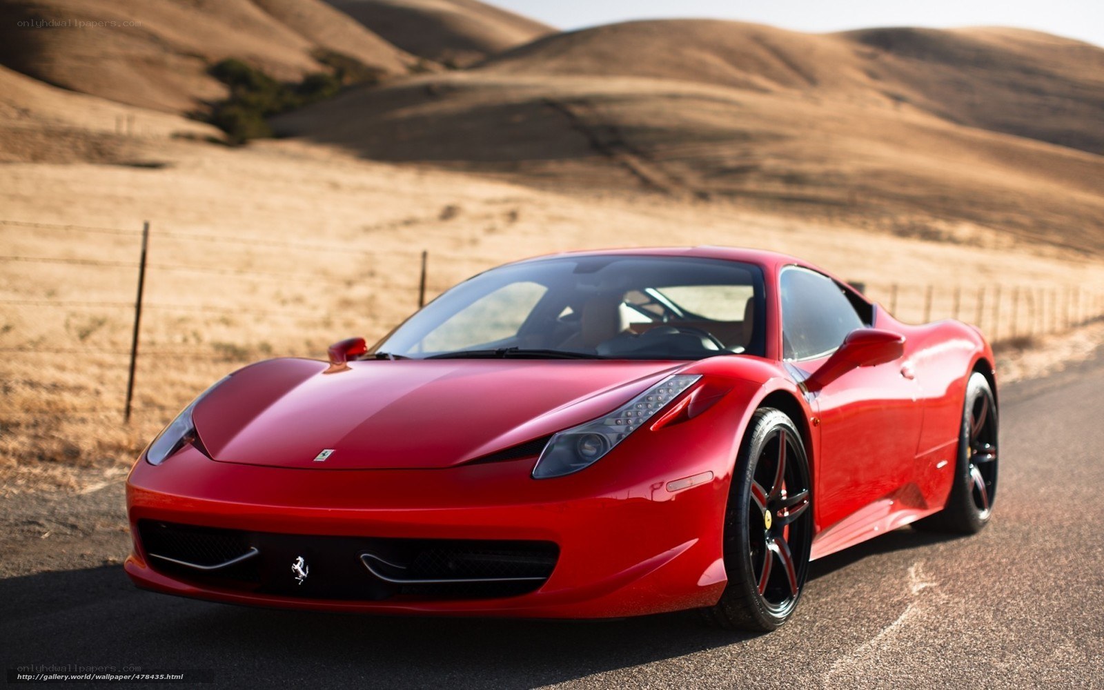 Red Ferrari on a desert road