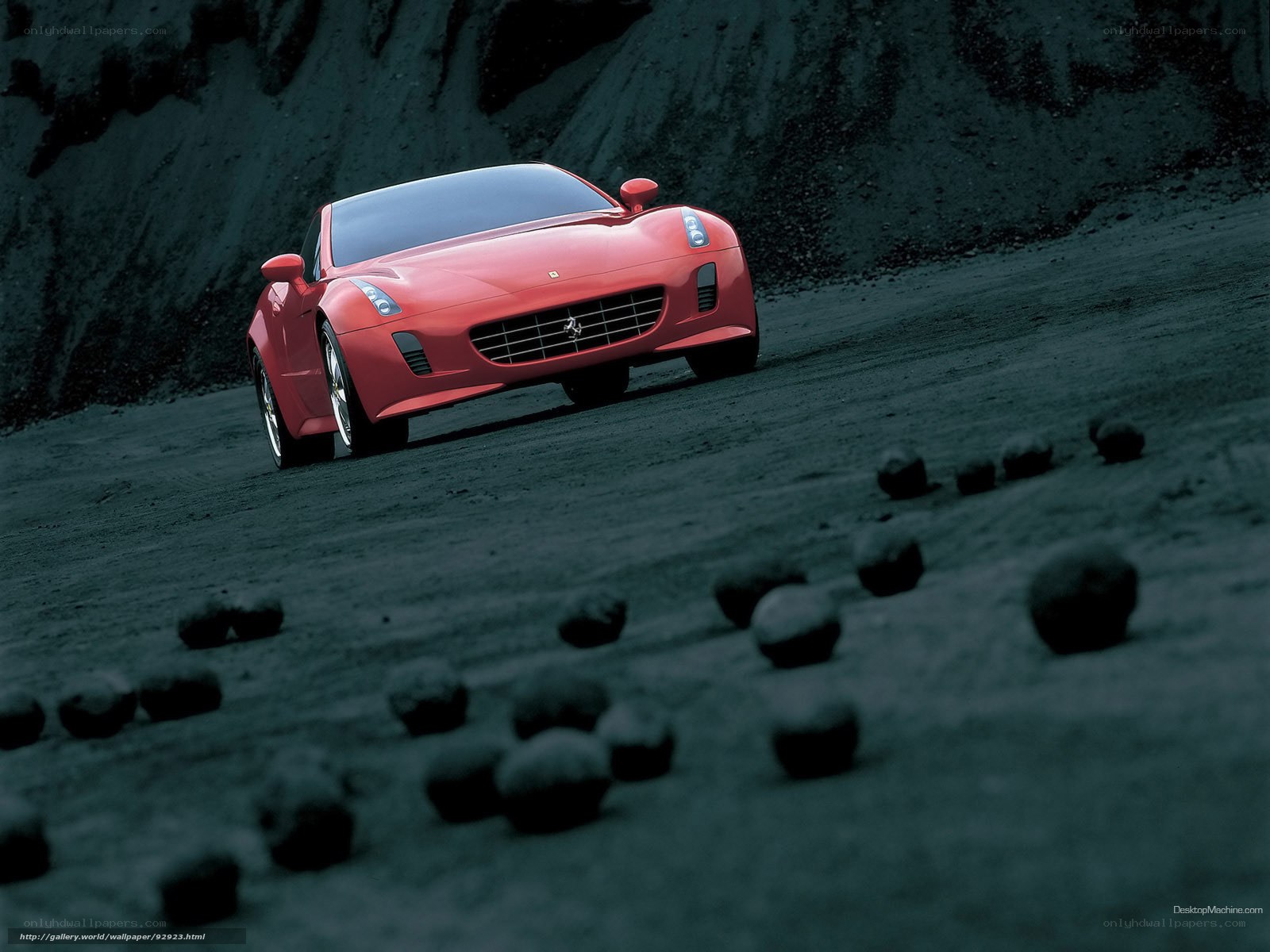 Red Ferrari on a dirt road