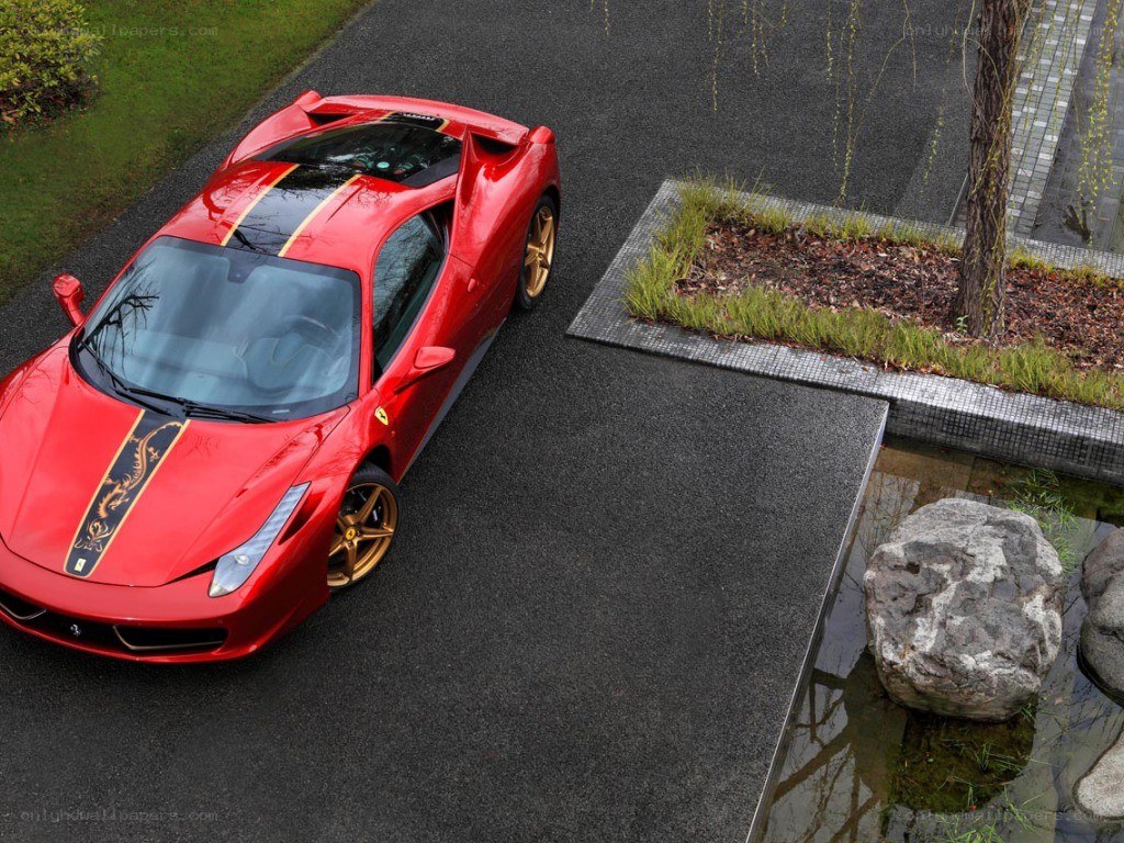Red Ferrari on a driveway