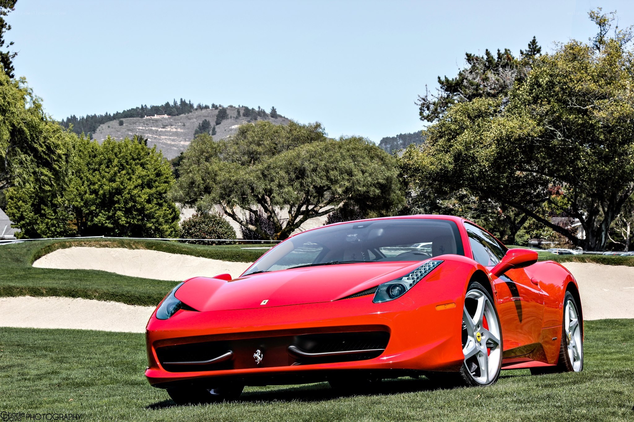 Red Ferrari on a golf course