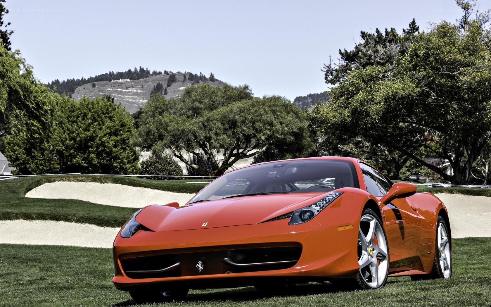 Red Ferrari on a golf course