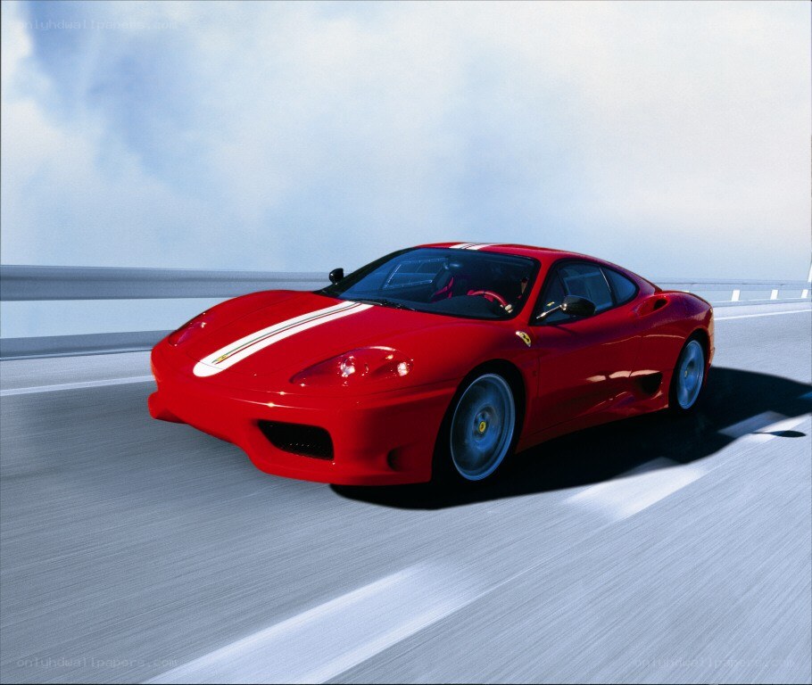Red Ferrari on a highway