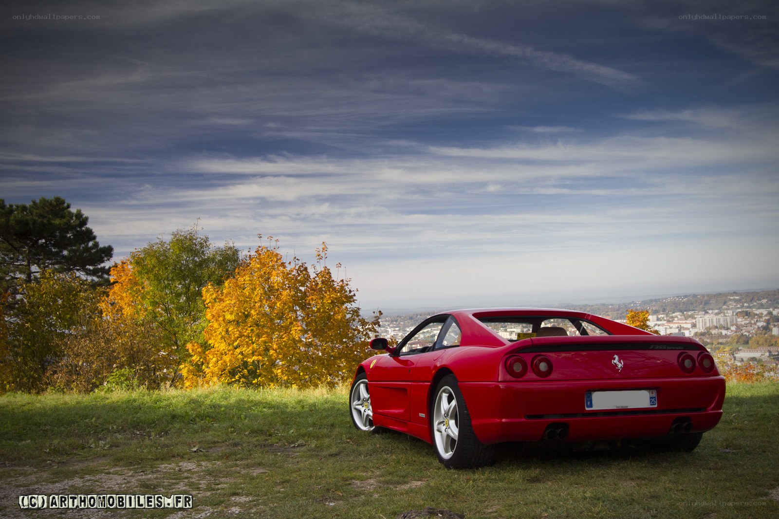 Red Ferrari on a hillside