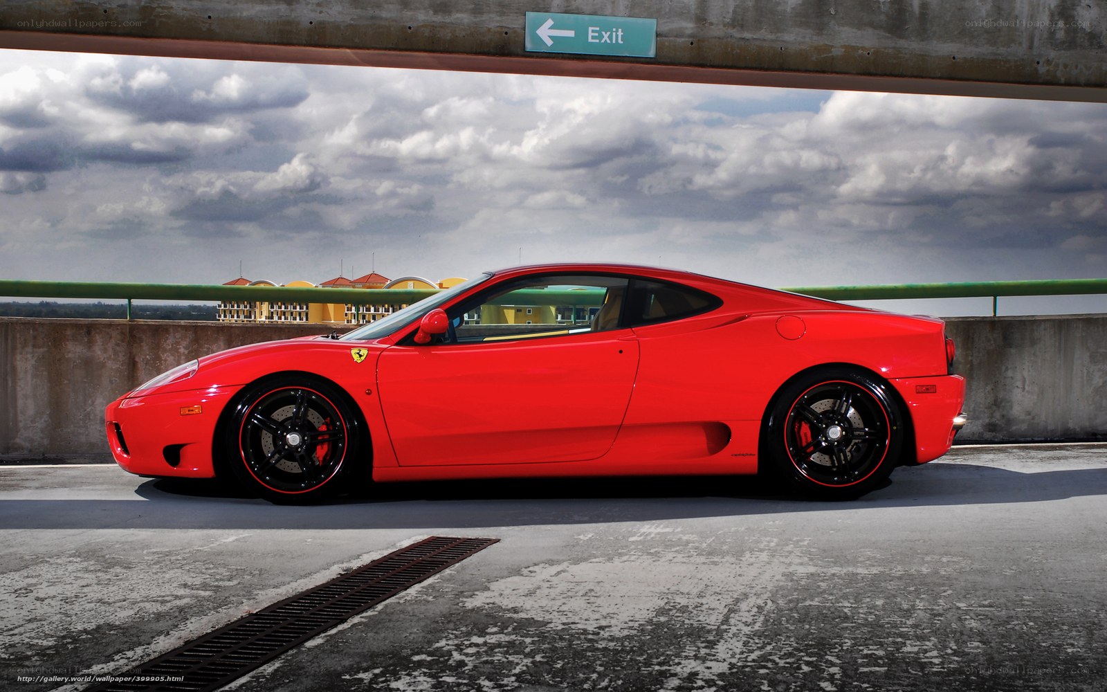 Red Ferrari on a parking deck
