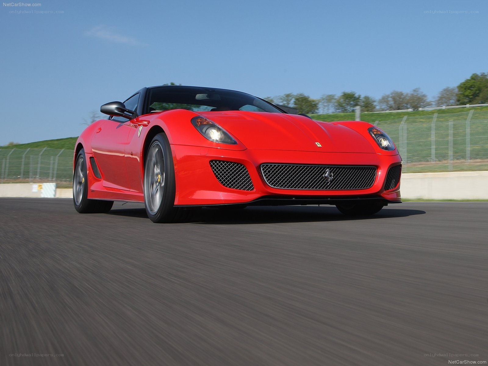 Red Ferrari on a racetrack