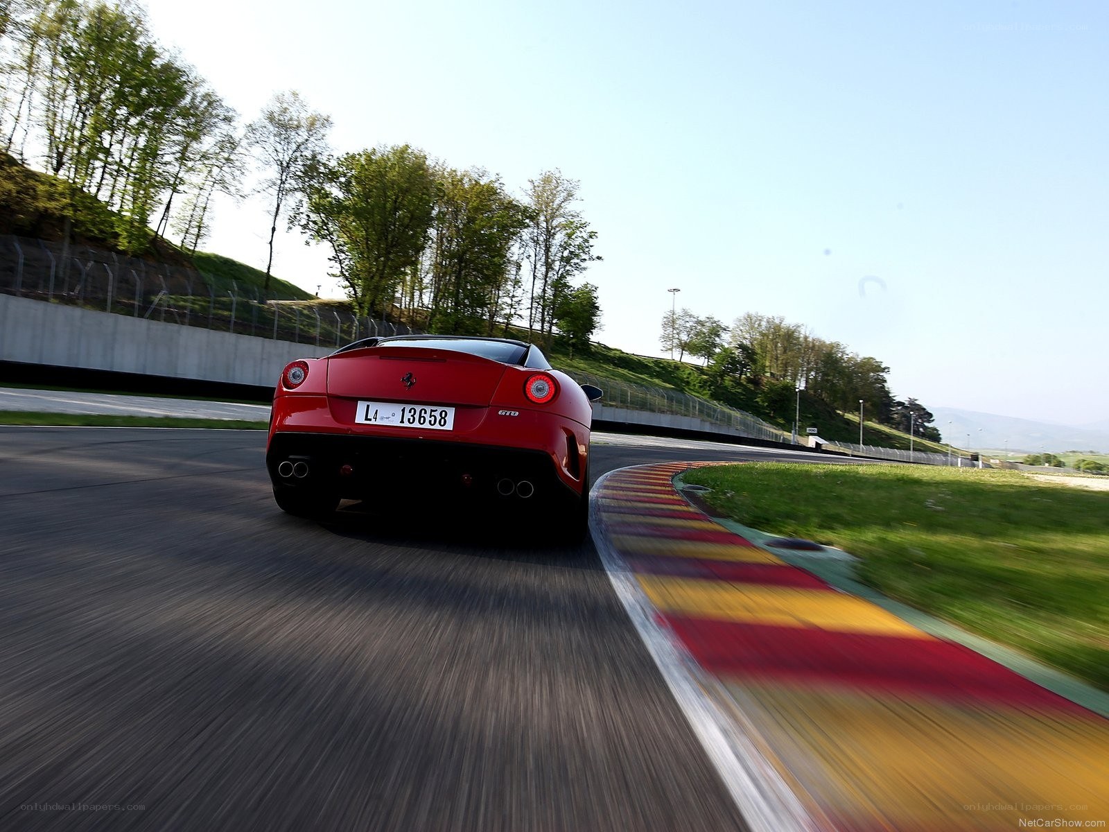Red Ferrari on a racetrack