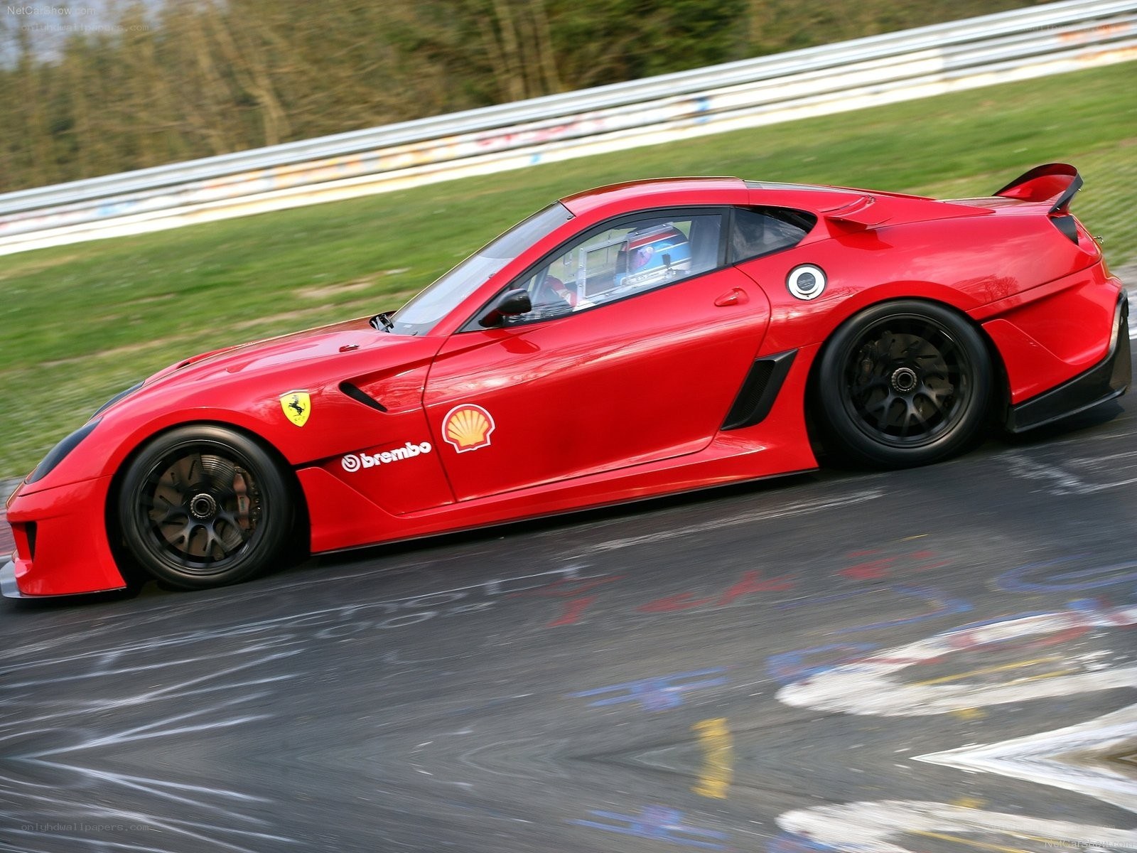 Red Ferrari on a racetrack