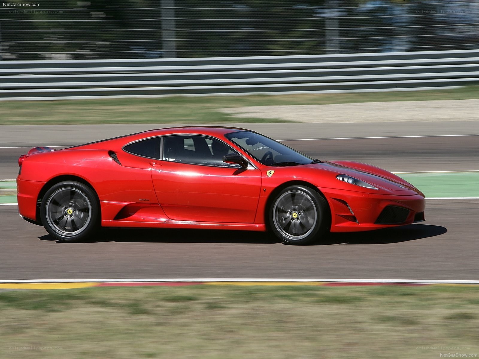 Red Ferrari on a racetrack
