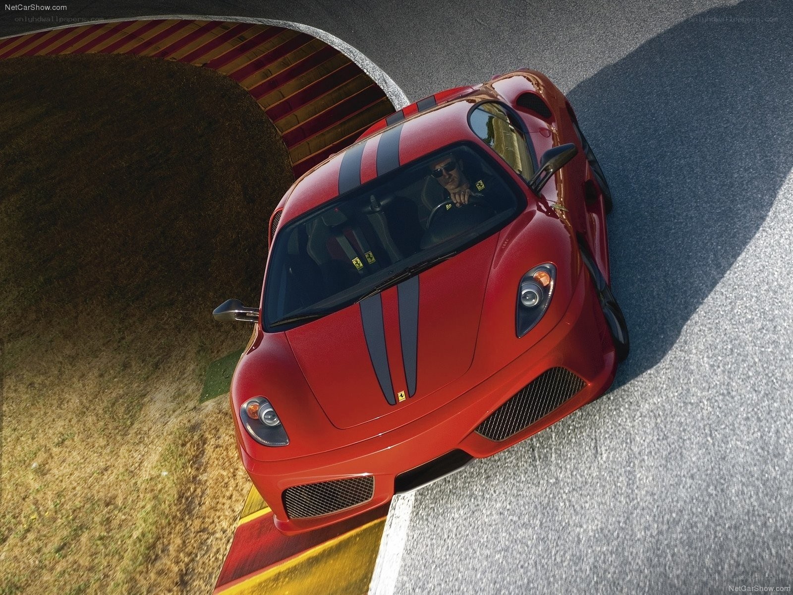 Red Ferrari on a racetrack