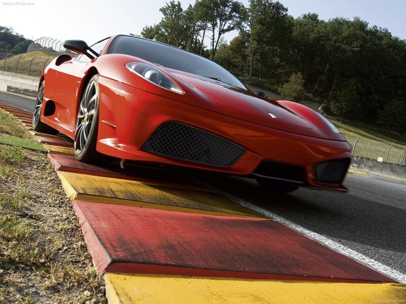 Red Ferrari on a racetrack