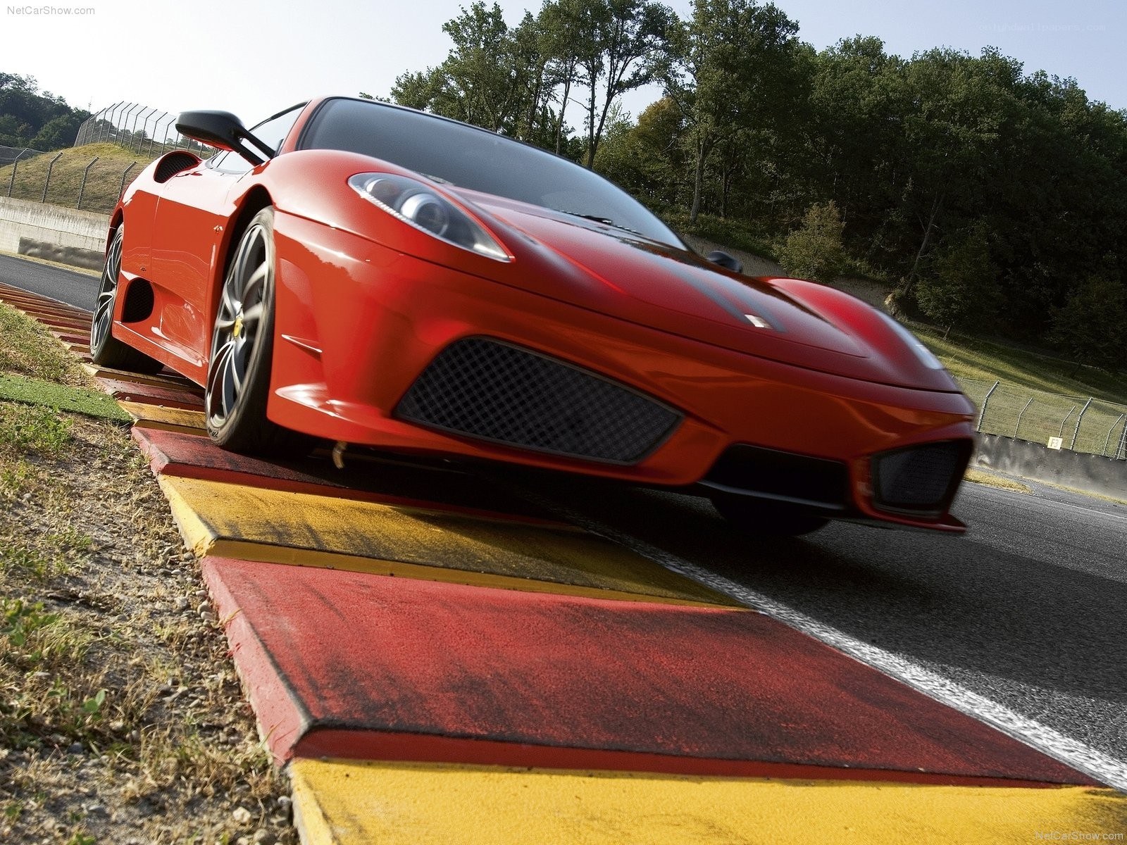 Red Ferrari on a racetrack