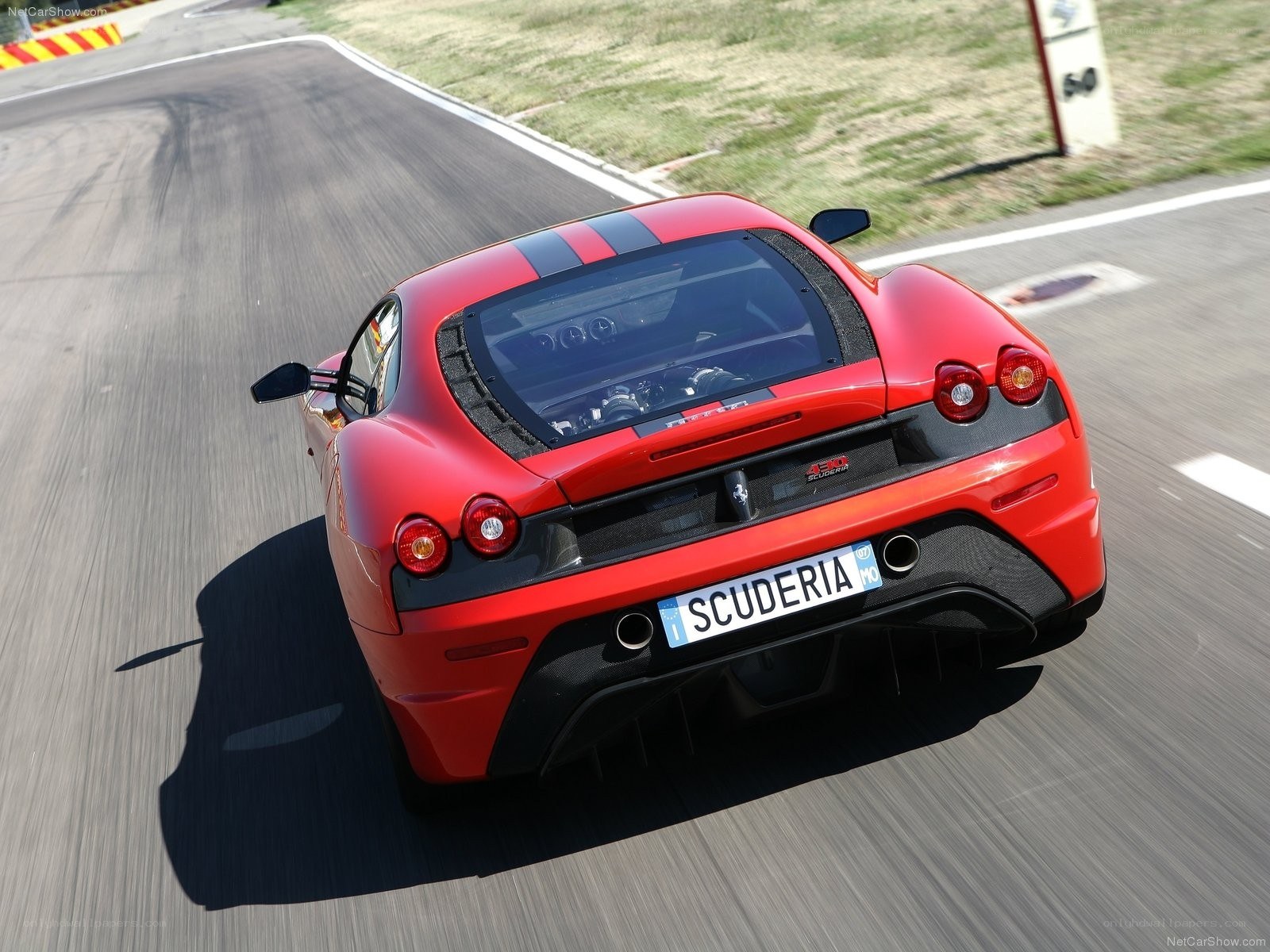 Red Ferrari on a racetrack