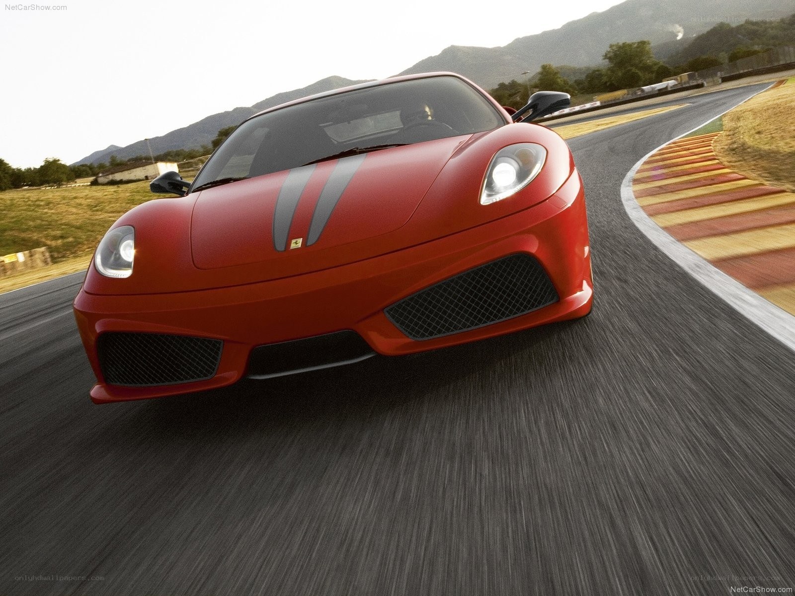 Red Ferrari on a racetrack
