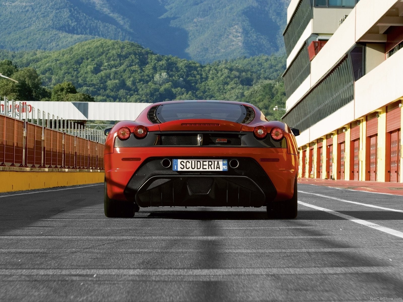 Red Ferrari on a racetrack